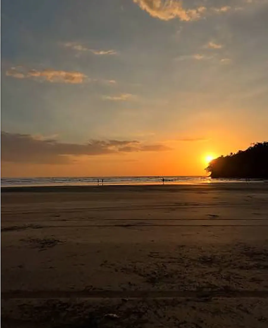 Playa Estero, Santa Catalina: black sand at low tide, where the surf lessons happen